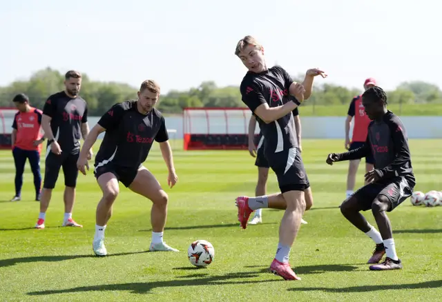 Manchester United Europa League
Caption: Manchester United’s squad, including Amad Diallo and Matthijs de Ligt, training for the 2025